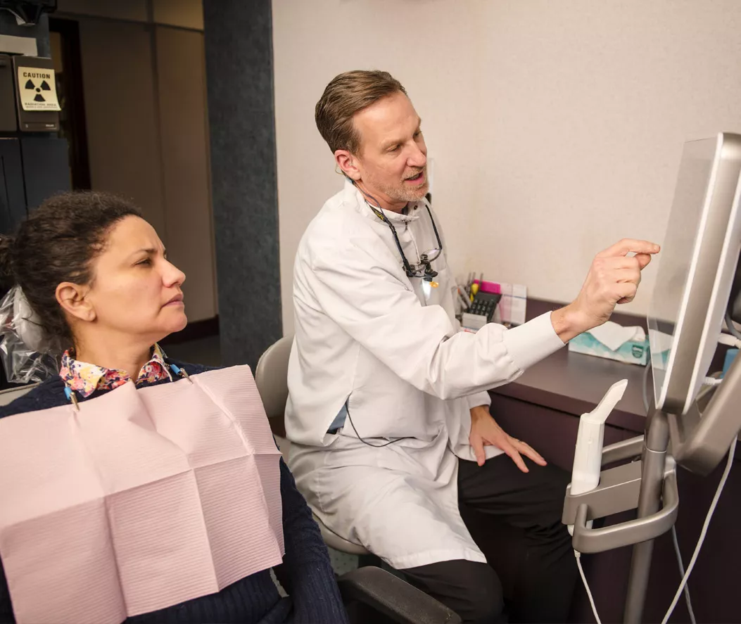 Explaining dental procedure to patient